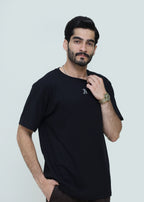 Black drop shoulder shirt by theseventhstitch displayed on a hanger with detailed fabric texture and relaxed fit.