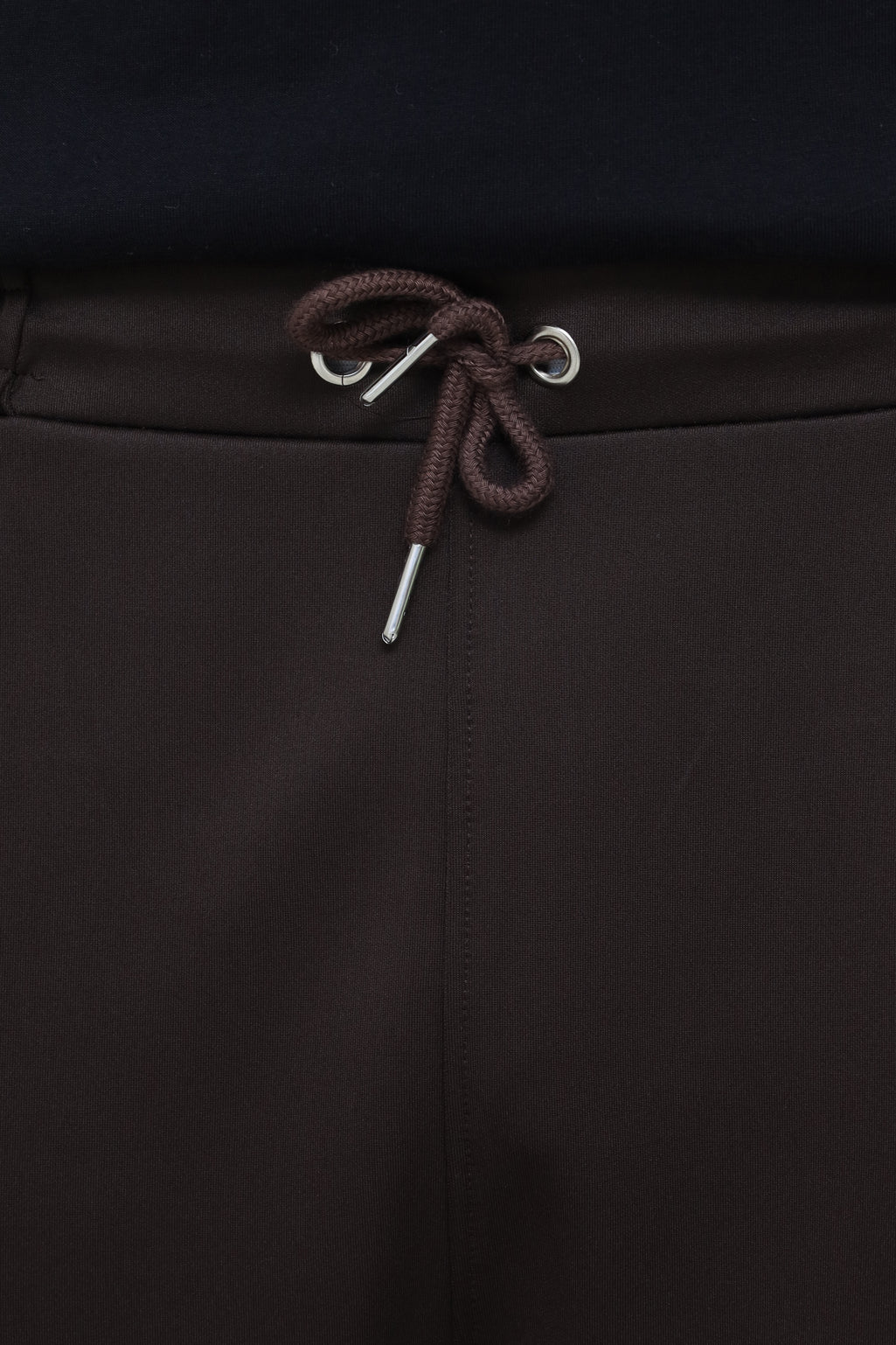 Premium men's pleated trousers by theseventhstitch, showcasing tailored fit and classic pleats in a neutral fabric.