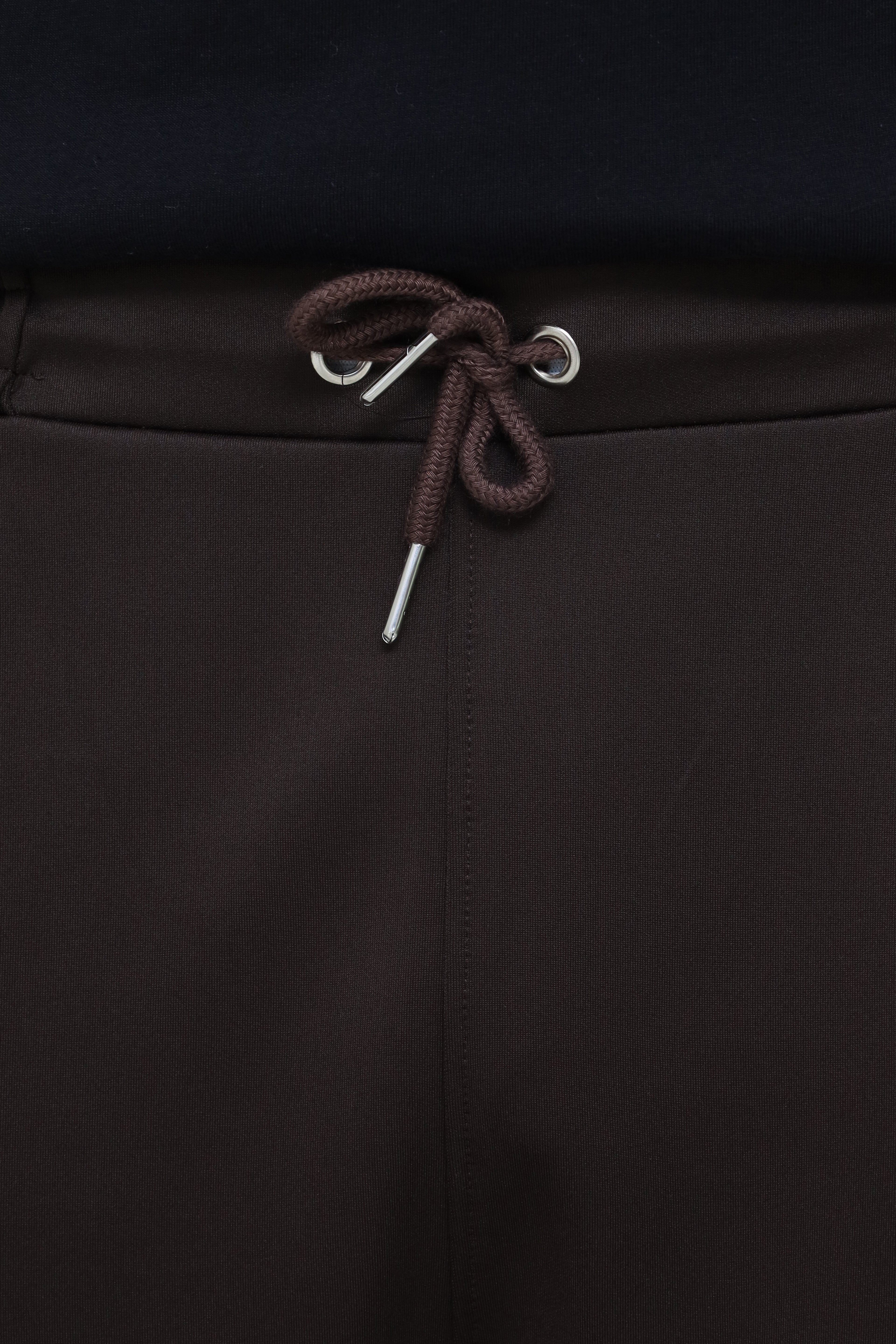 Premium men's pleated trousers by theseventhstitch, showcasing tailored fit and classic pleats in a neutral fabric.
