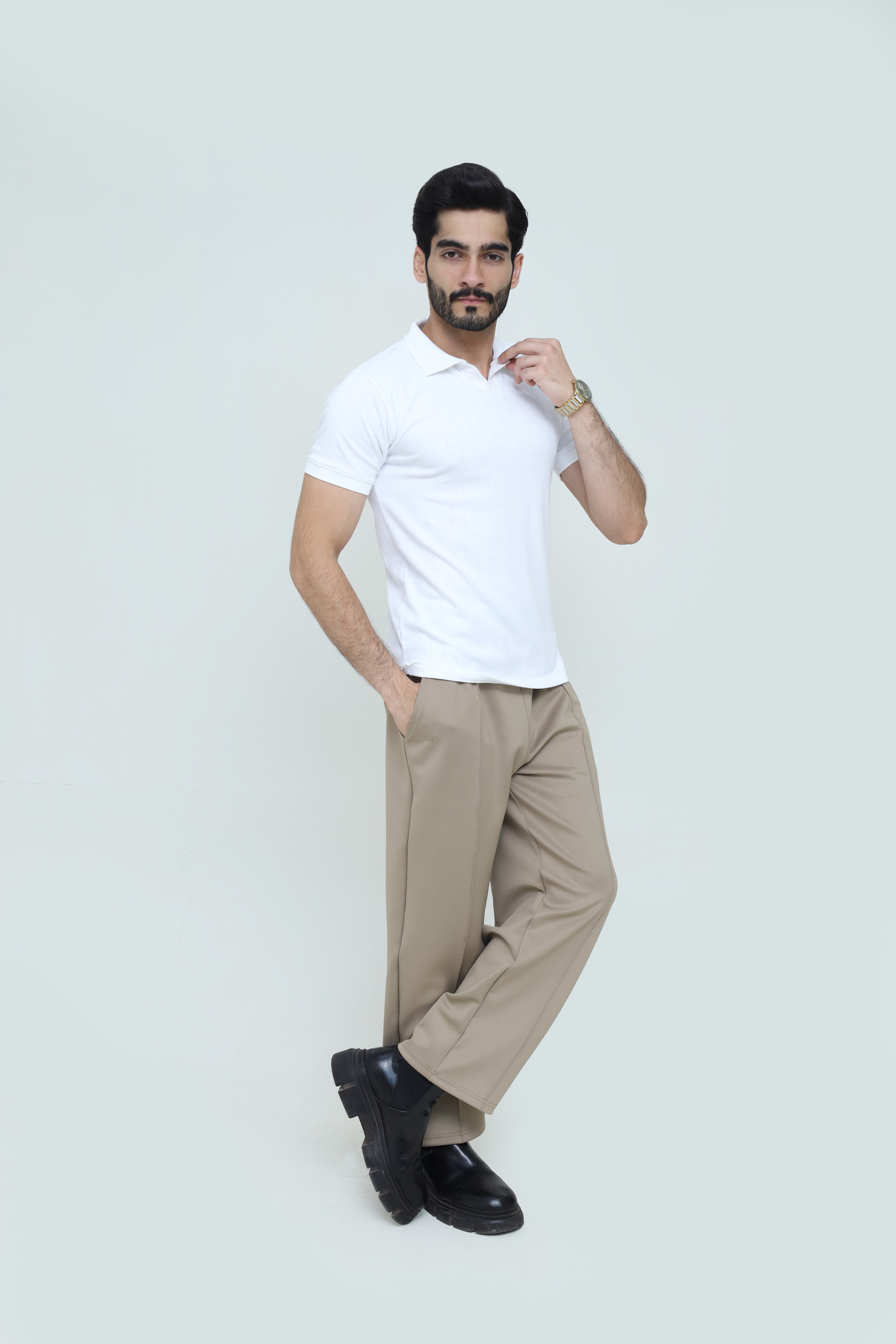 Classic white polo shirt and luxury pleated trousers set by theseventhstitch, featuring a clean, stylish look with tailored fit.