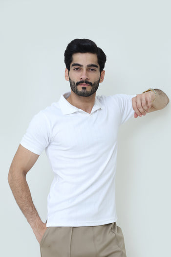 White cable-knit polo shirt from theseventhstitch featuring a classic collar and textured knit fabric.