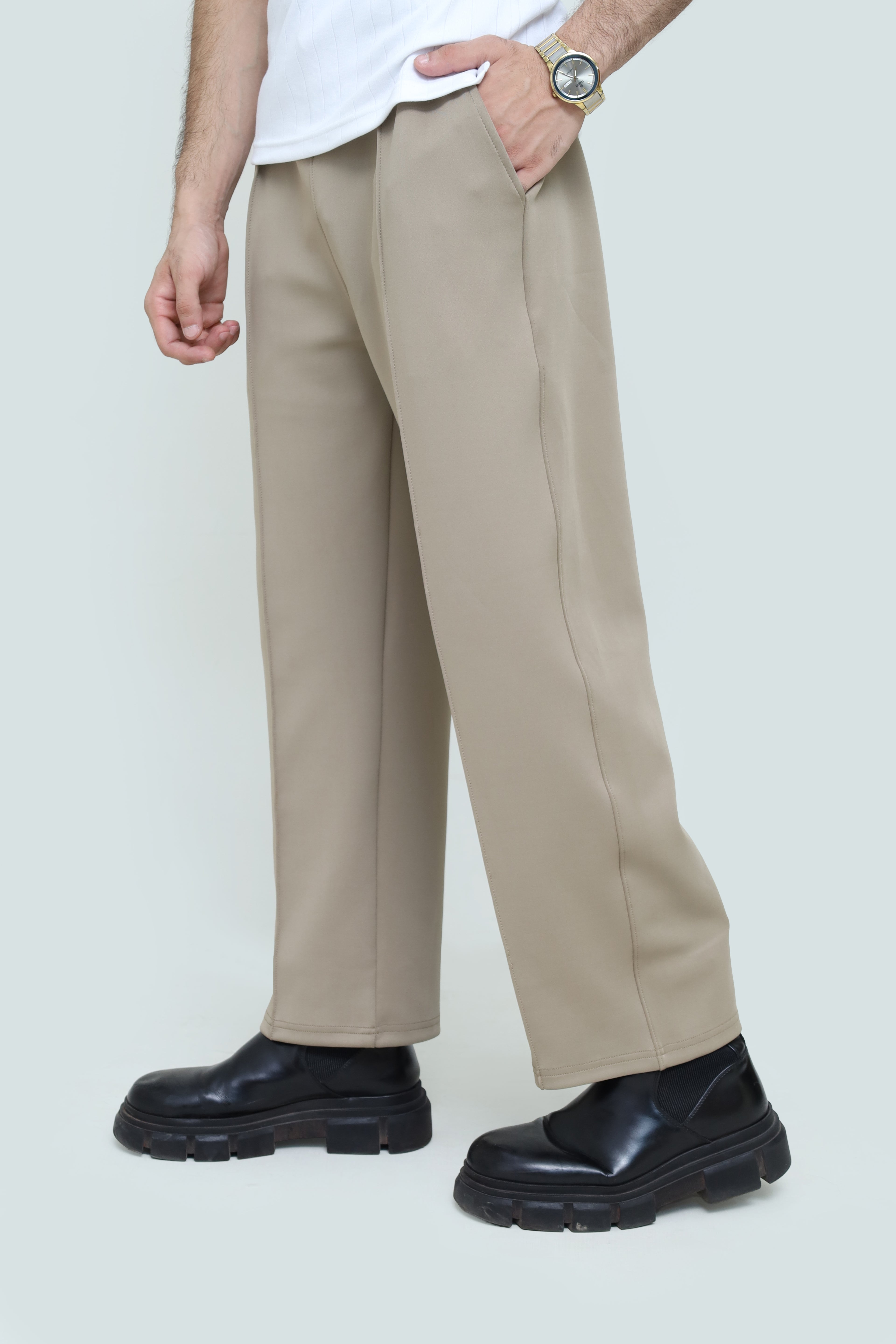 Men’s pleated trousers by theseventhstitch, tailored fit with classic pleats, in a versatile neutral color, front view.