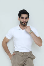 Classic white polo shirt and luxury pleated trousers set by theseventhstitch, displayed on a model.